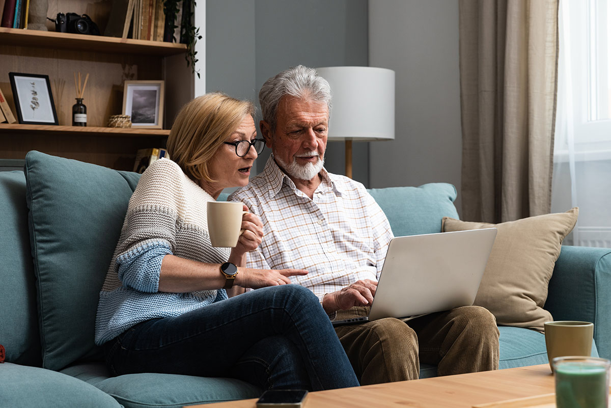 Older Couple using computer BoomerTech Adventures
