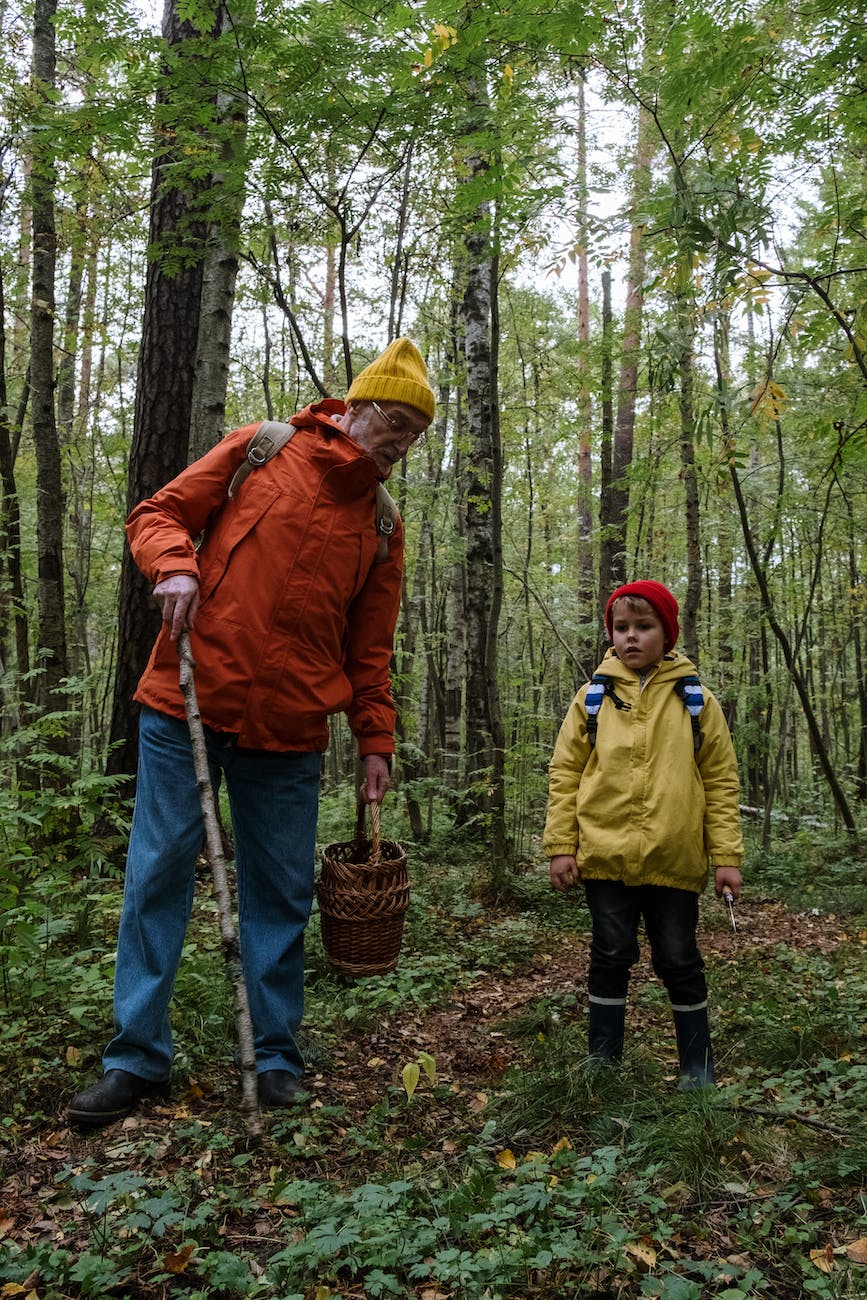 pexels-photo-6034584 a man spending time with his grandson in a forest