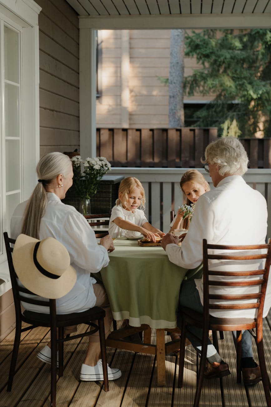 pexels-photo-5960382 grandparents and children sitting at a table
